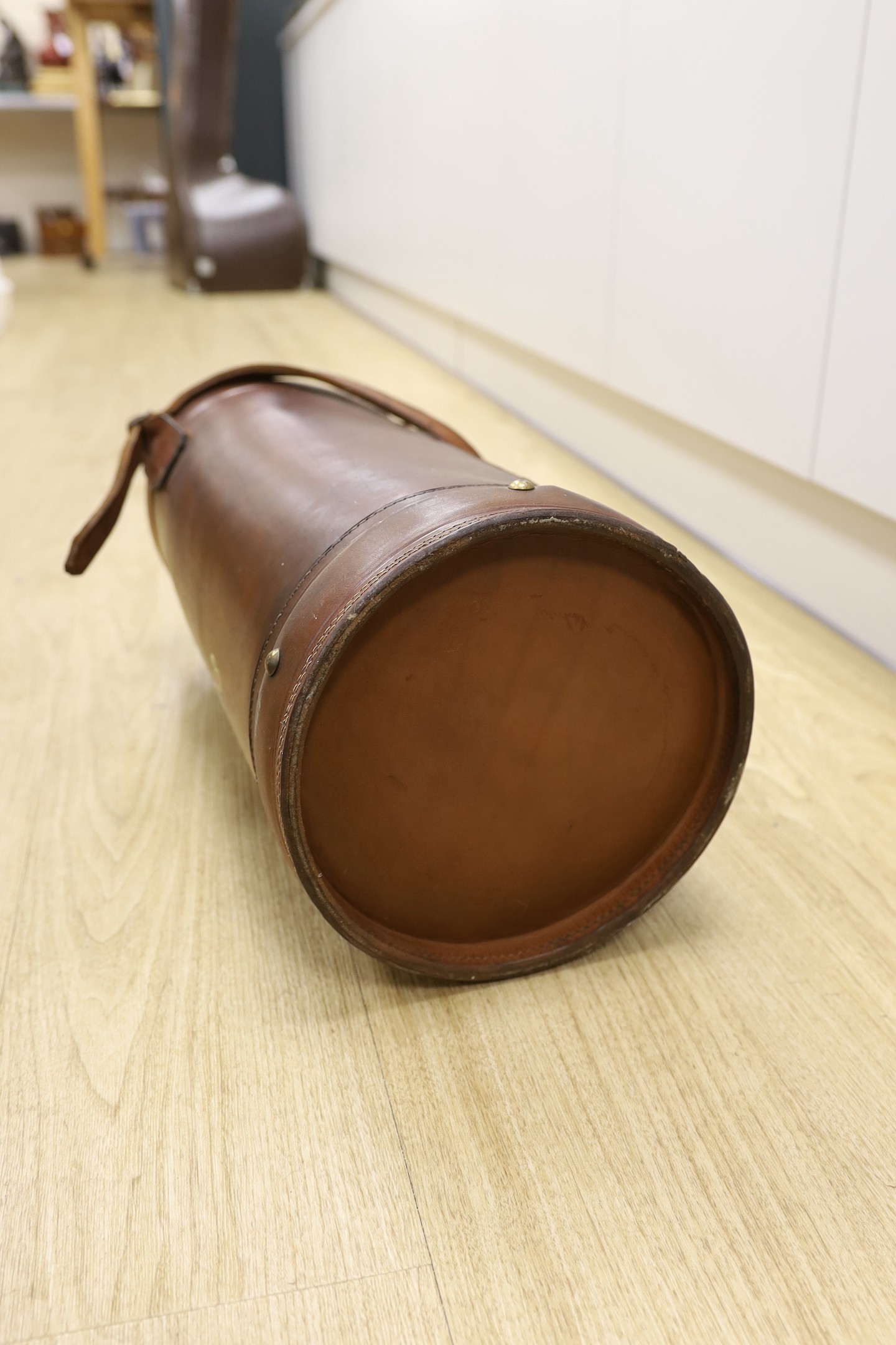 A brown leather hod carrier